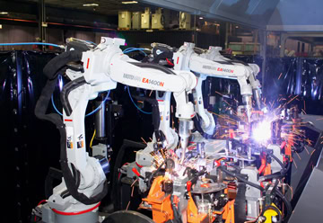 Image of two robots welding