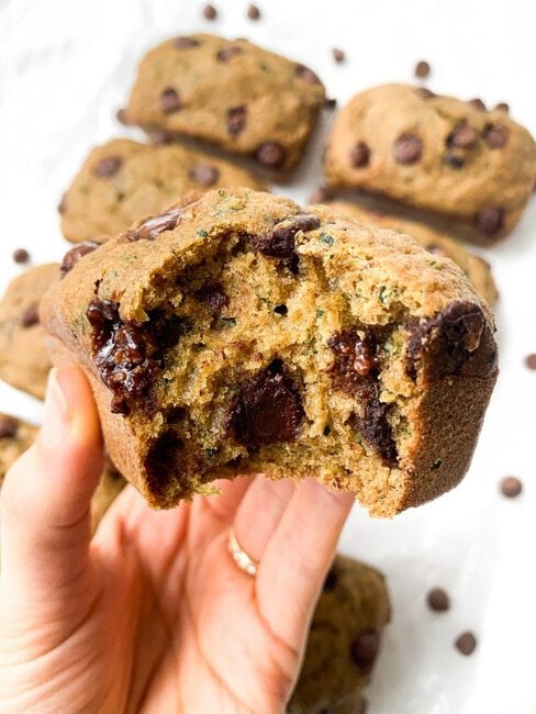 Healthy Whole Wheat Zucchini Bread with Chocolate Chips is fluffy, moist, and sneaks in some added fiber and nutrients thanks to the shredded zucchini. Made with good-for-you ingredients like coconut sugar and whole wheat flour. #wholewheat #zucchinibread #healthyrecipes #healthybaking #healthy #wholewheatzucchinibread #healthyrecipe Whole Wheat Chocolate Chip Zucchini Bread