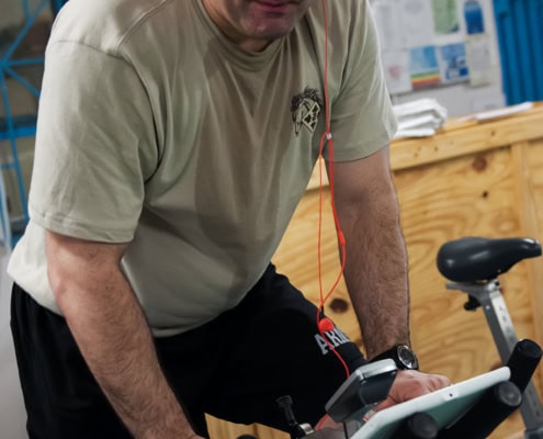 Patient on stationary bike during ACL rehabilitation