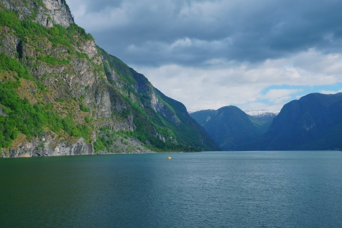 aurlandsfjord_cloudy_norway View of mountains and water in the aurlandsfjord on a cloudy day