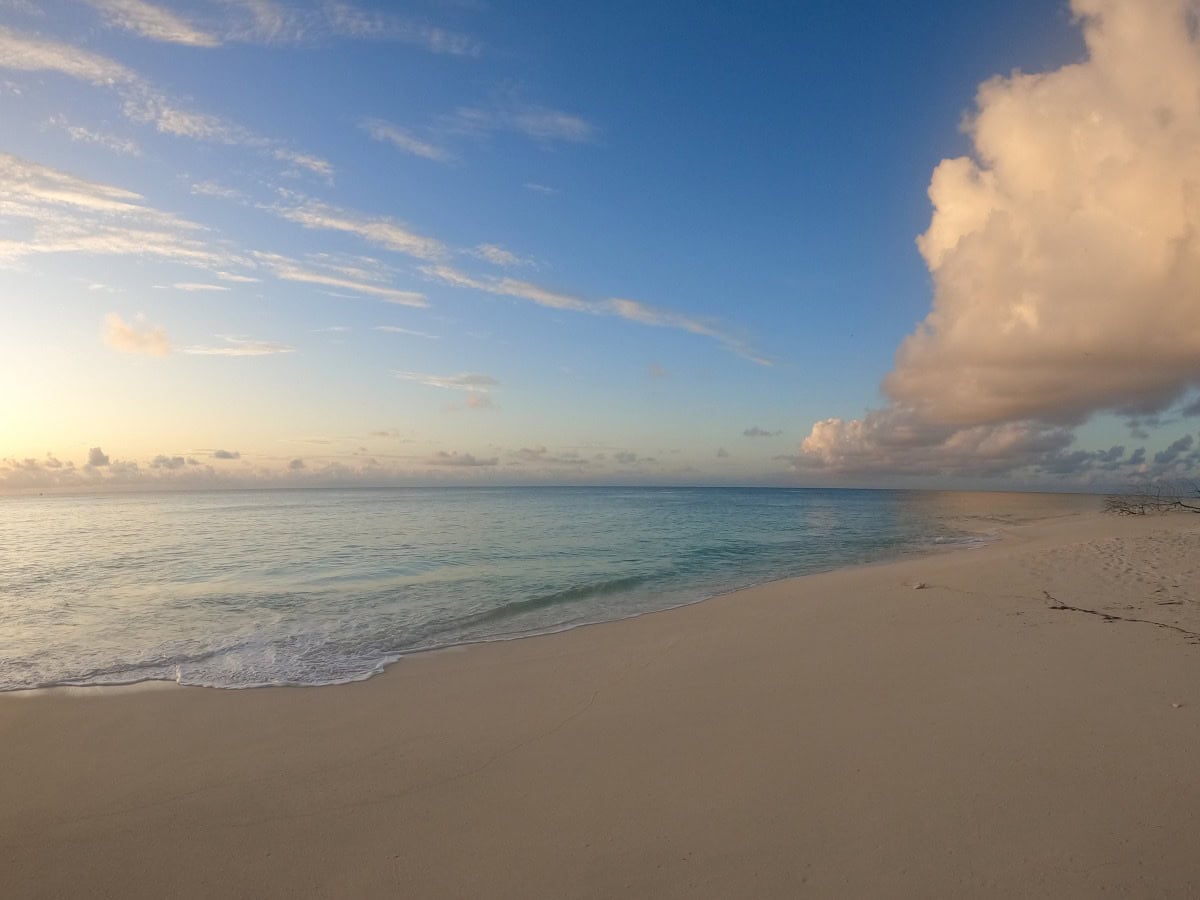 seychelles_tropical_beach_sunset Deserted beach at sunset on the North Coast of Denis Private Island