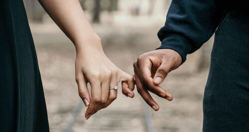 Couple holding hands