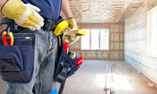 Handyman helping a homeowner safely