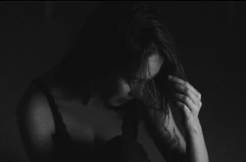 Woman head down black and white