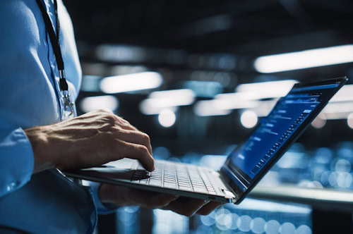 person typing on a computer