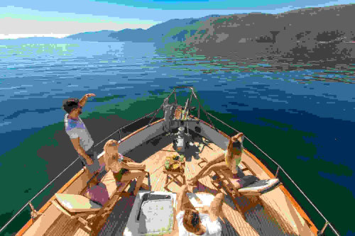 Luxury private boat tour in Opatija – guests on board a spacious motor yacht