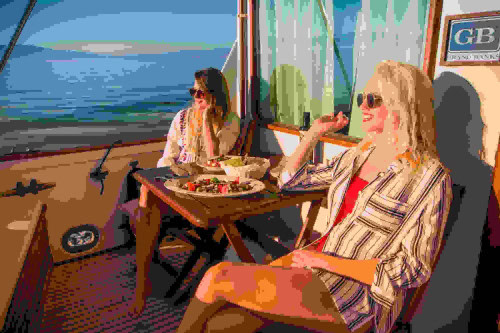 Luxury private boat tour in Opatija – guests on board a spacious motor yacht