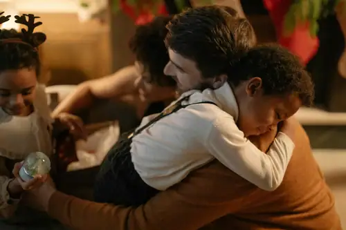 Warm family embrace, nurturing child emotional needs