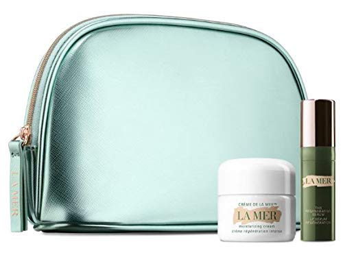 A luxurious La Mer Regenerating Mini Miracles Skin Care Set featuring a metallic mint green pouch, a jar of Crème de la Mer moisturizing cream, and a bottle of The Regenerating Serum.
