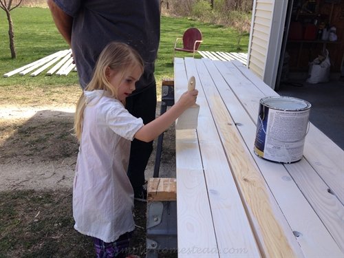 painting the picket fence boards | ASimpleHomestead.com
