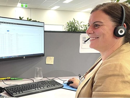 AMC commercial cleaning employee conducting a phone audit as part of Freshdesk communication and quality management support for commercial cleaning services.