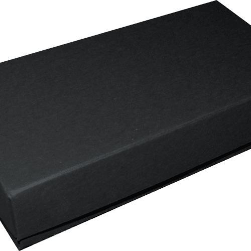 Black rectangular box with a lid, closed, photographed from an angled perspective.