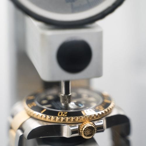 Watch being pressure-tested during resealing after a battery replacement