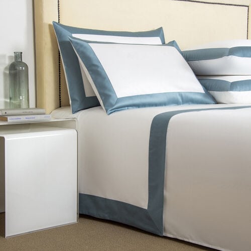 A Frette bedding set in blue and white colors