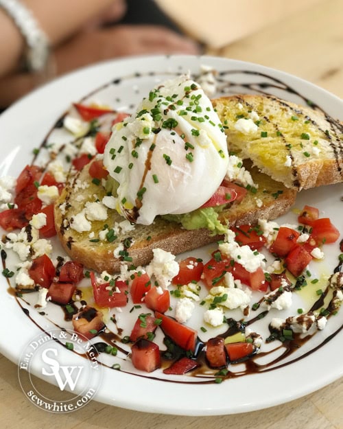 sourdough toast with poached eggs and feta cheese