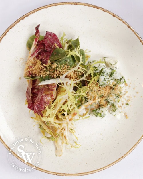 The fresh and vibrant crab salad with crunchy leaves.