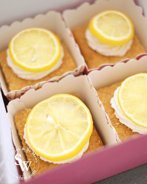 golden brown traybake topped with fresh lemon. Lemon curd centre