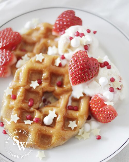 doughnut waffles covered with sprinkles and served with ice cream 