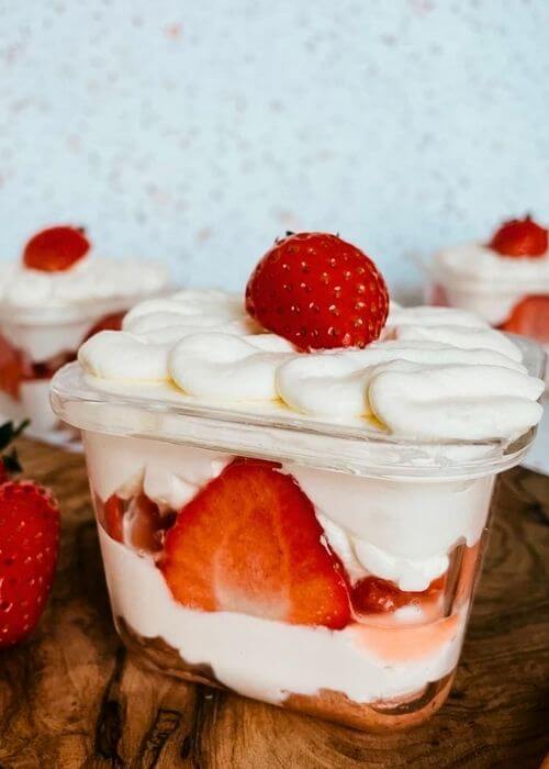 5 ingredients Mini Strawberry Cake Pots 1 mini strawberry cake pots with strawberries around, on a wooden board, speckled background