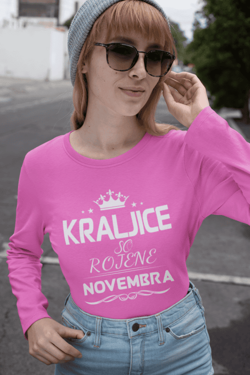 long sleeve tee mockup of a woman wearing a beanie and glasses on a street 29060 27