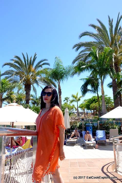 Seafolly cover up in orange and sunglasses by the pool at Gran Anfi Resort, Gran Canaria Seafolly cover up in orange and sunglasses by the pool at Gran Anfi Resort, Gran Canaria