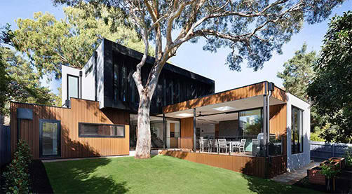Contemporary residential home with modern design elements and spacious outdoor deck.