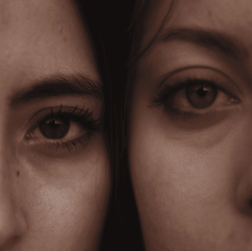 two women side by side looking at camera