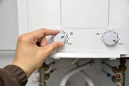 Commercial Tankless Water Heaters Bethlehem and Allentown PA Allentown Plumber Adjusting Temperature of Commercial Tankless Water Heater Installed in Bethlehem Pennsylvania
