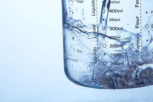 Commercial Water Testing Allentown and Bethlehem PA Bethlehem Plumber Testing Water in a Glass in an Allentown Commercial Space