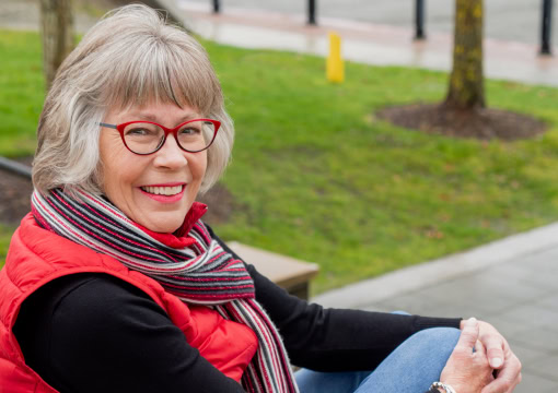 Sharon sitting in a park