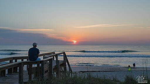 Beautiful sunrise and waves at Satellite Beach, one of the top Space Coast attractions for beach lovers and surfers.