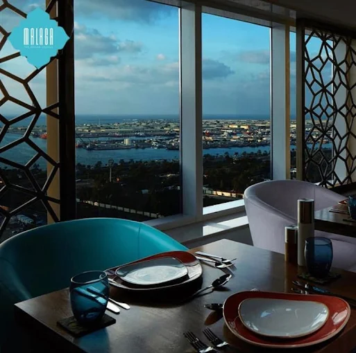 Waterfront shisha lounge with ocean views at Malaga Lounge.