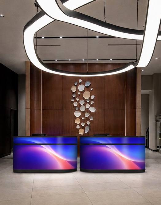 Fronta Series Front Desk LED Display in luxury hotel reception area