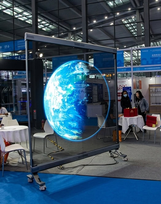 InviAir Holographic LED Screen at exhibition - mobile transparent display showing 3D Earth for events and trade shows
