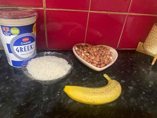 Chura Gerteh cooking in a pot, being stirred gently with a wooden spoon