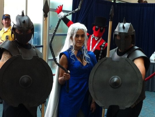 One cos-player photobombs other cos-players