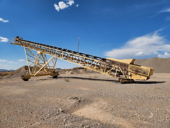 Radial Stacker - 24” wide x 100’ long Fixed Height Radial Conveyor