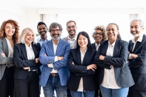Business team of multiracial people standing in front of camera during meeting