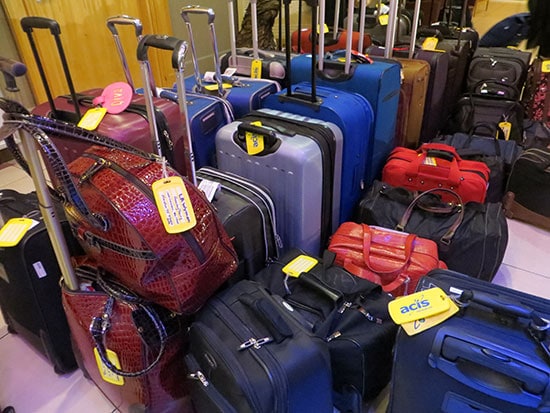 An ACIS group's suitcases and bags with our ACIS luggage tags