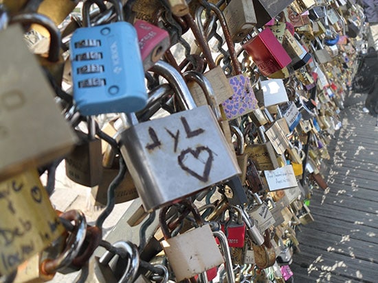 padlocks attached along a fence