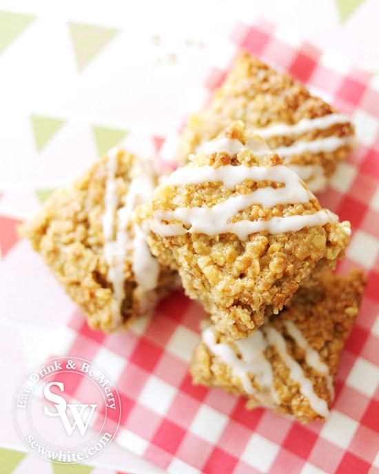 Golden Lemon and Ginger Flapjacks with a white drizzle icing on a check napkin for the Royal Wedding