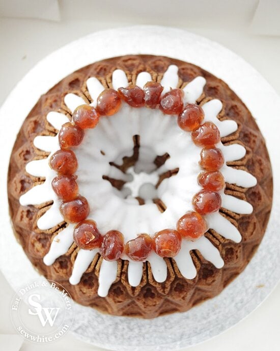 A beautiful bundt cherry cake topped with glacé cherries