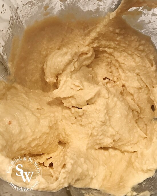 Easy Homemade Vegan Hummus in the blender looking creamy and delicious