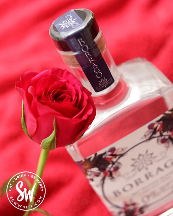 A valentine's Day rose with a bottle Borrago.