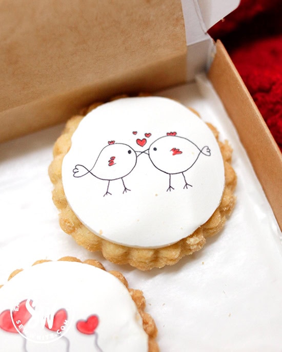 love birds kissing on an iced biscuit for Valentines Day by Bumble and Goose in the Valentine's Day Gift Guide