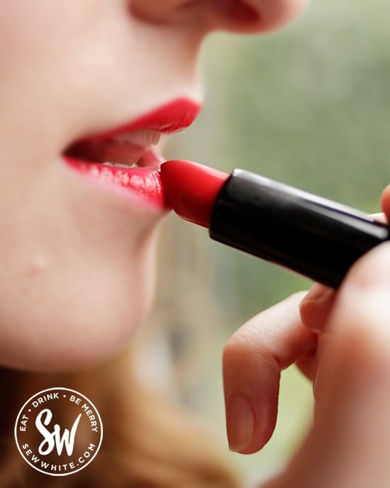 Sisley White lifestyle blogger testing out the rose red lipstick for Note Cosmetics.