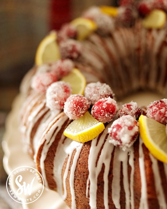 dusted cranberries with slices of lemon on the Cranberry and Lemon Bundt Cake