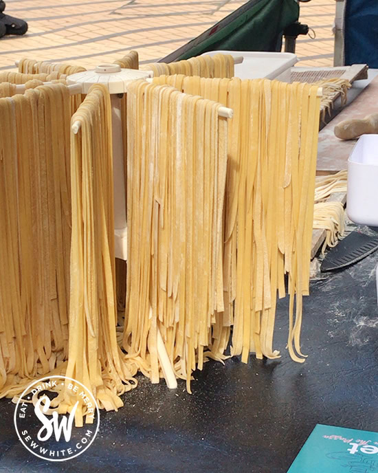 Fresh pasta drying on a stand