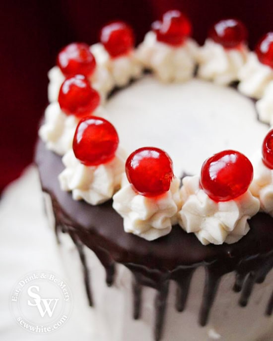 Easy Black Forest Cake topped with buttercream towers and cherries