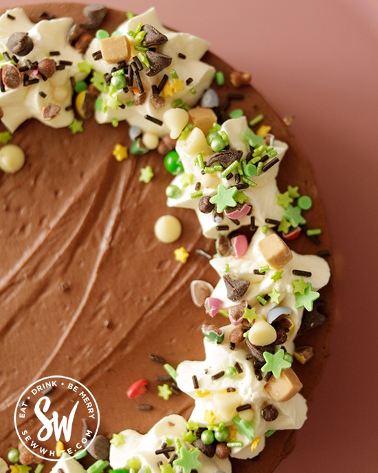 Close up of the Ireland green sprinkles on top of the Guinness Chocolate cheesecake perfect for St Patrick's Day. 